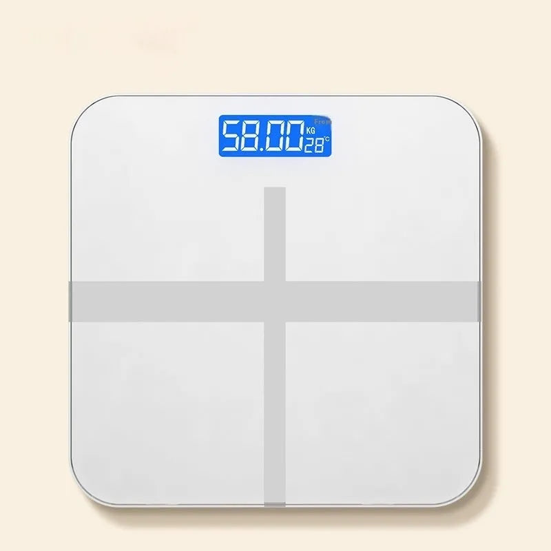 Household digital bathroom scale with large tempered glass top in rose gold finish on white bathroom floor.