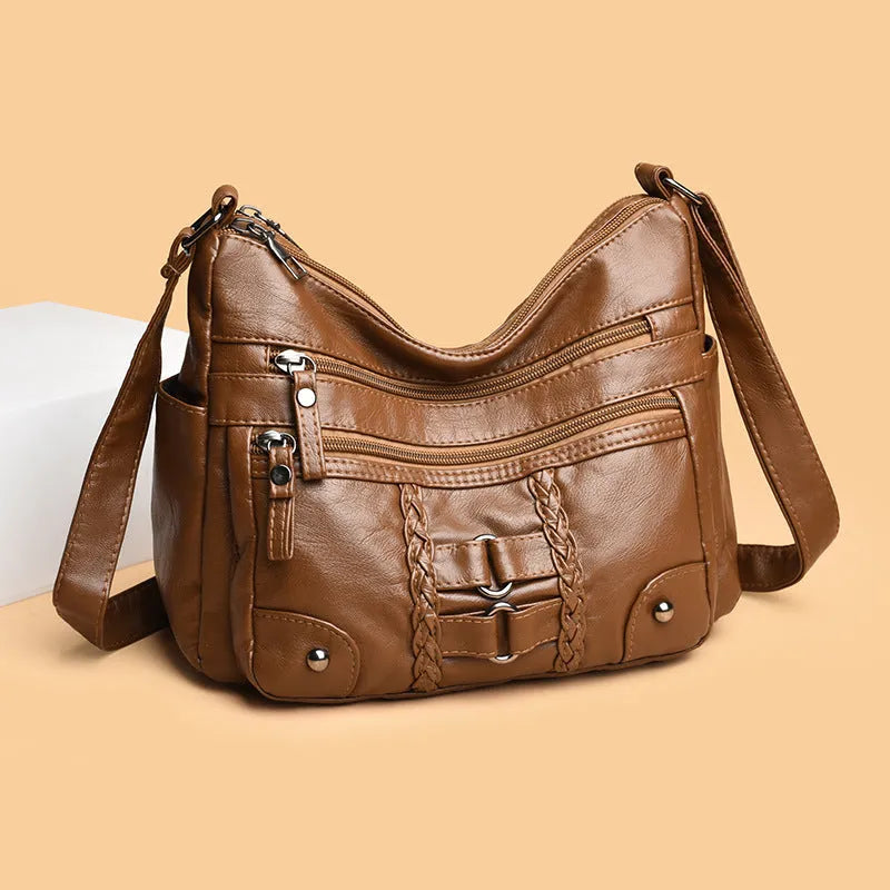 PU shoulder messenger bag with single strap, open outer pocket, and zip inner compartment in black, red, brown, or beige.