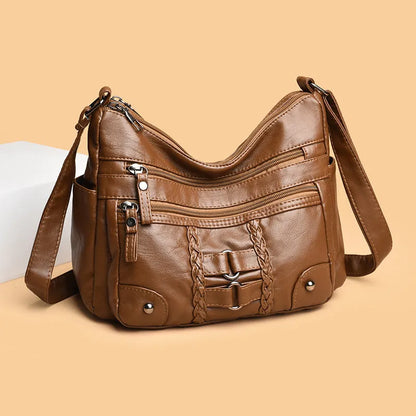 PU shoulder messenger bag with single strap, open outer pocket, and zip inner compartment in black, red, brown, or beige.
