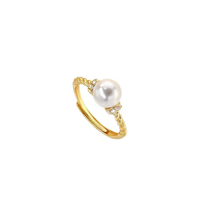 Adjustable copper ring with pearl inlay in geometric twist design, gold or silver finish