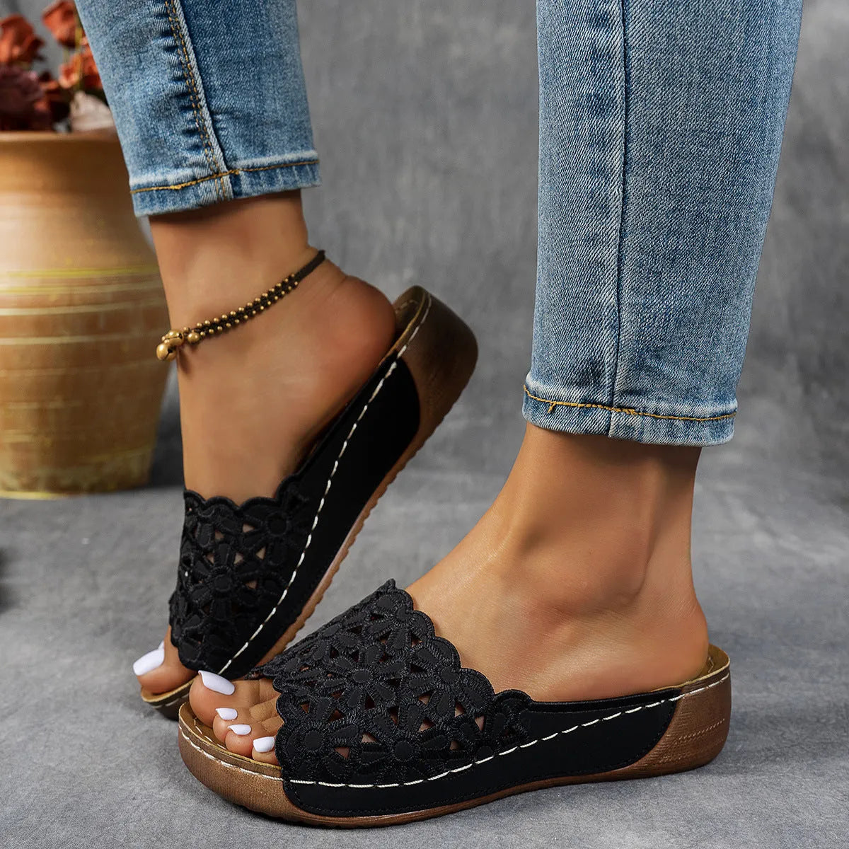 Women's black wedge beach slippers with flower cutout decoration on the PVC upper