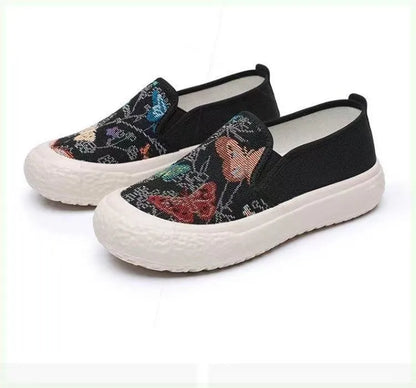 Women's classic canvas slip-on shoes with plastic soles in black and white colour options