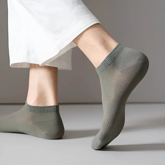 Pair of solid colour low-cut polyester boat socks for men, shown in one of six available colour options.