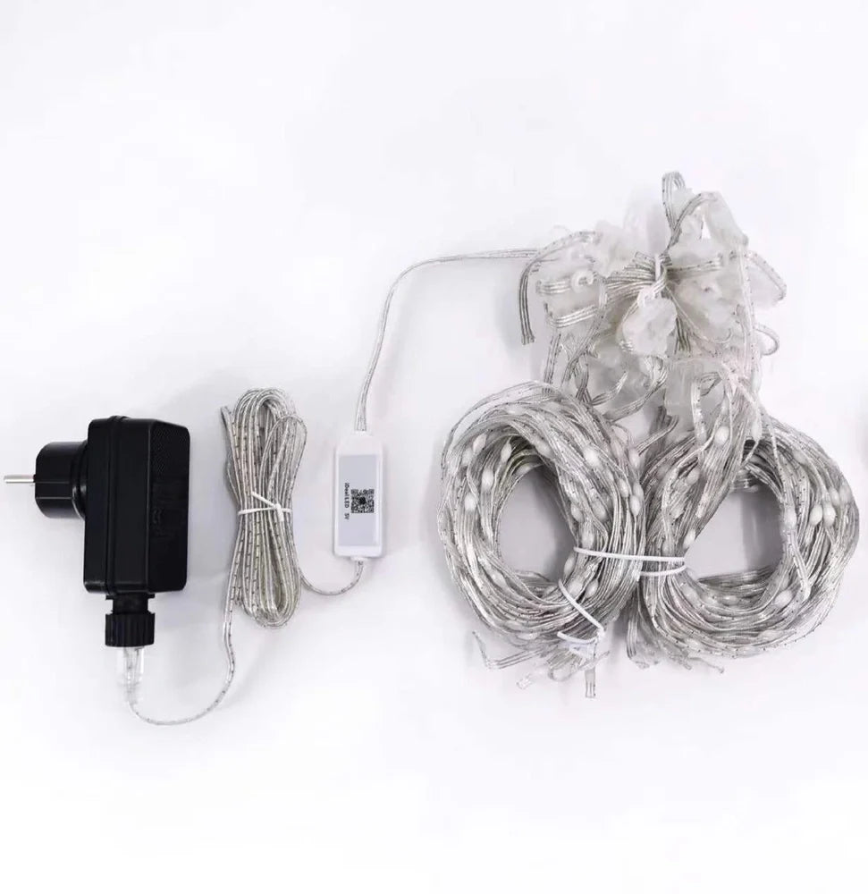 Programmable LED curtain light with Bluetooth app control showing 400 individual lights in curtain formation