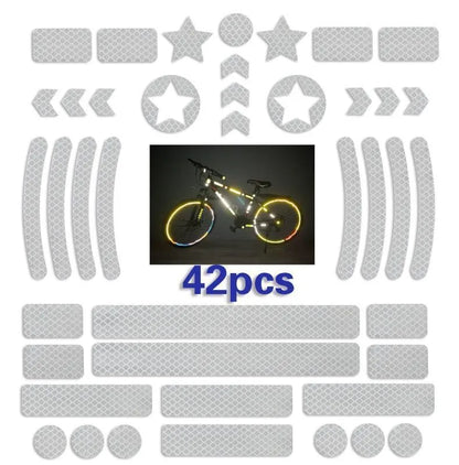 Geometric grid pattern reflective safety tape for bicycles in blue, red, white, and fluorescent yellow.