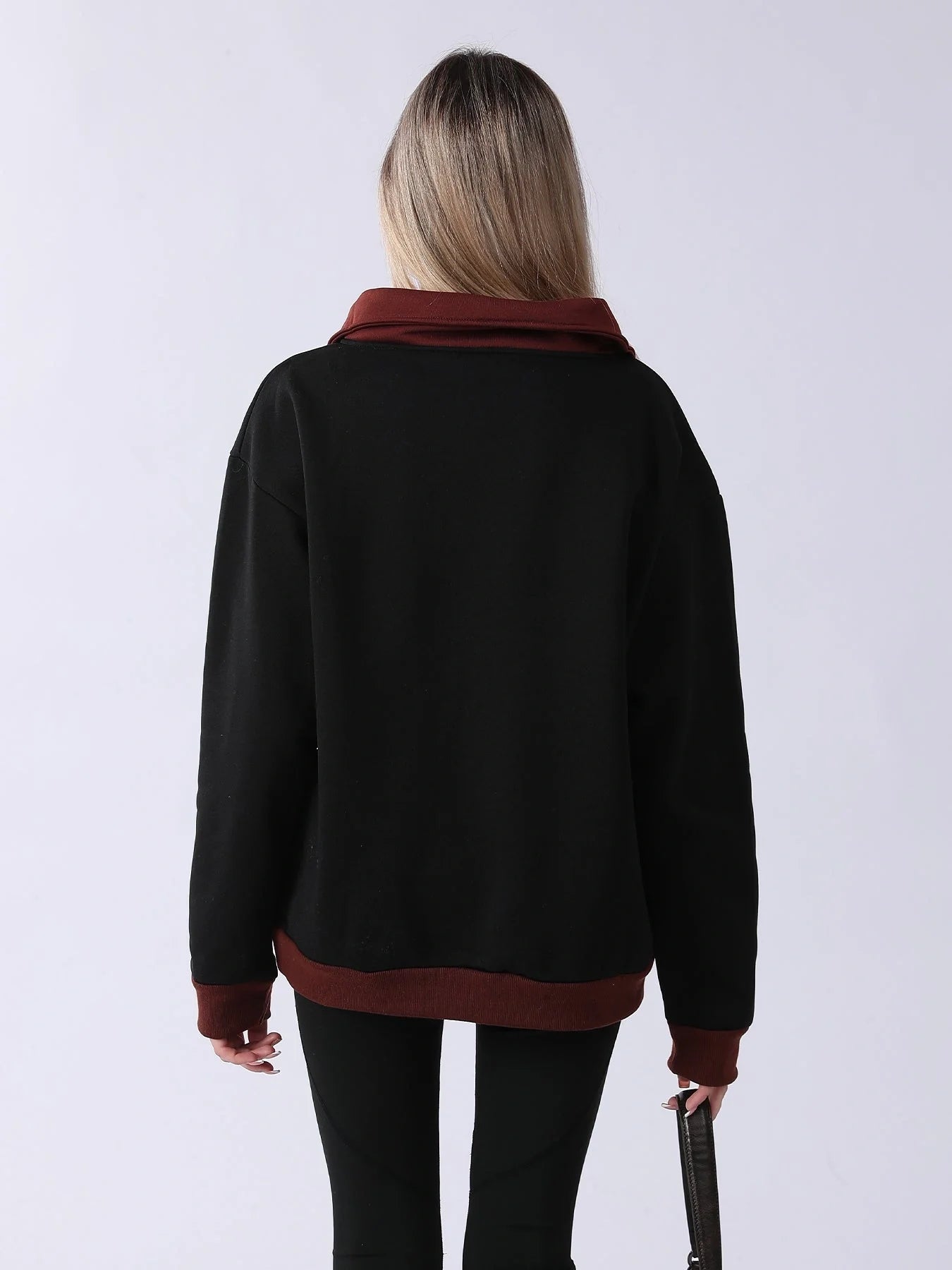 A cozy and comfortable women's long sleeve sweatshirt in black, featuring a relaxed and flattering fit for everyday wear.