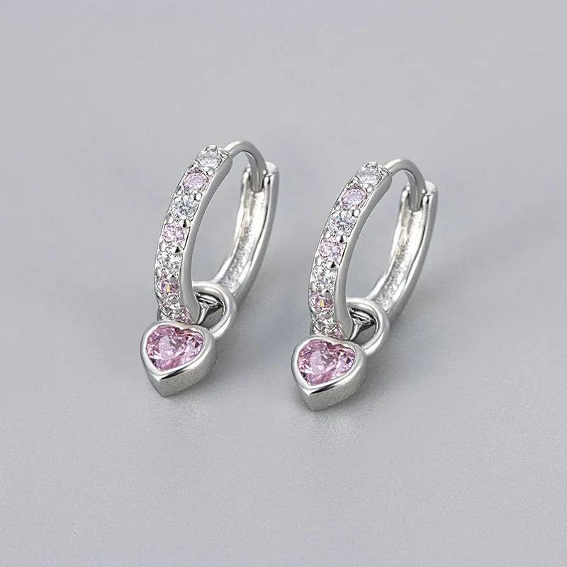 Fashion zircon earrings with 10mm heart-shaped drops in gold and white gold settings, showing diamond-treated stones