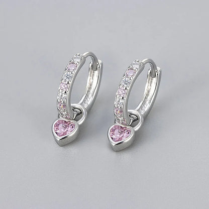 Fashion zircon earrings with 10mm heart-shaped drops in gold and white gold settings, showing diamond-treated stones