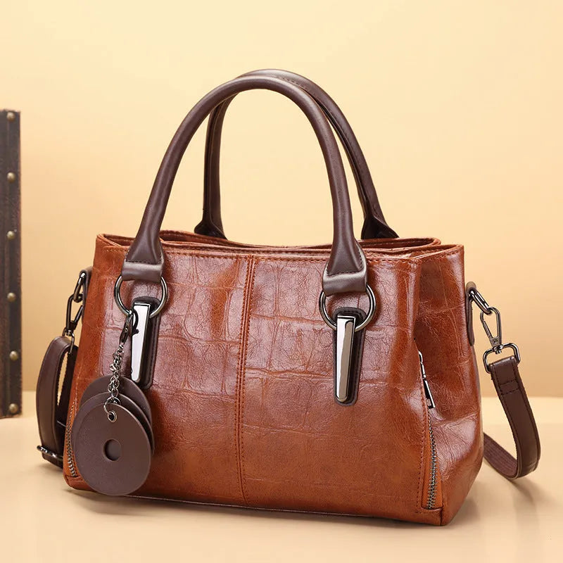 Retro contrast large capacity shoulder bag showing horizontal square shape and multiple internal compartments