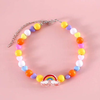 Colourful plastic bead cat necklace with adjustable clasp showing peach, rainbow, and small flower pattern options