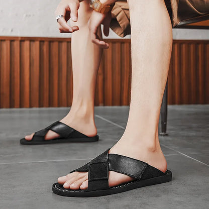 Men's black genuine leather slip-on sandals with rubber sole on a neutral background.