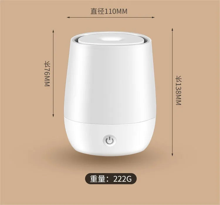 White USB aroma diffuser humidifier with simulated flame light effect on a table.