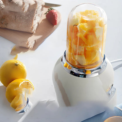 Small portable fruit juicer in blue with 400mL capacity cup and charging cable