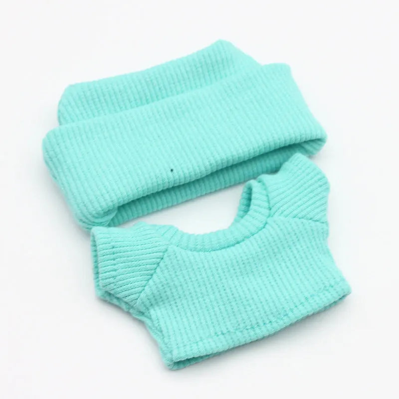 Doll clothes set with knitted flanging hat and T-shirt in multiple colours including pink, white, and stripes.