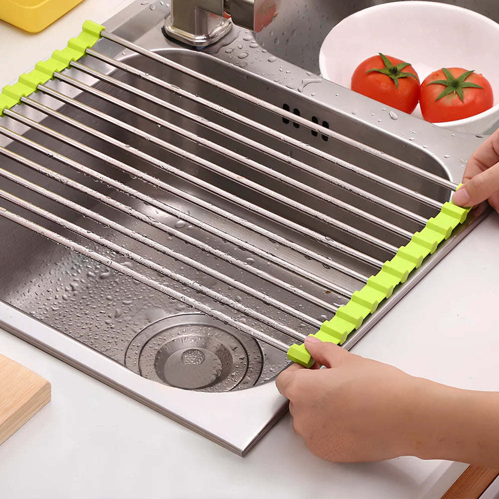 Black folding stainless steel sink drain rack with silicone edges, shown both unfolded for drying and folded for storage