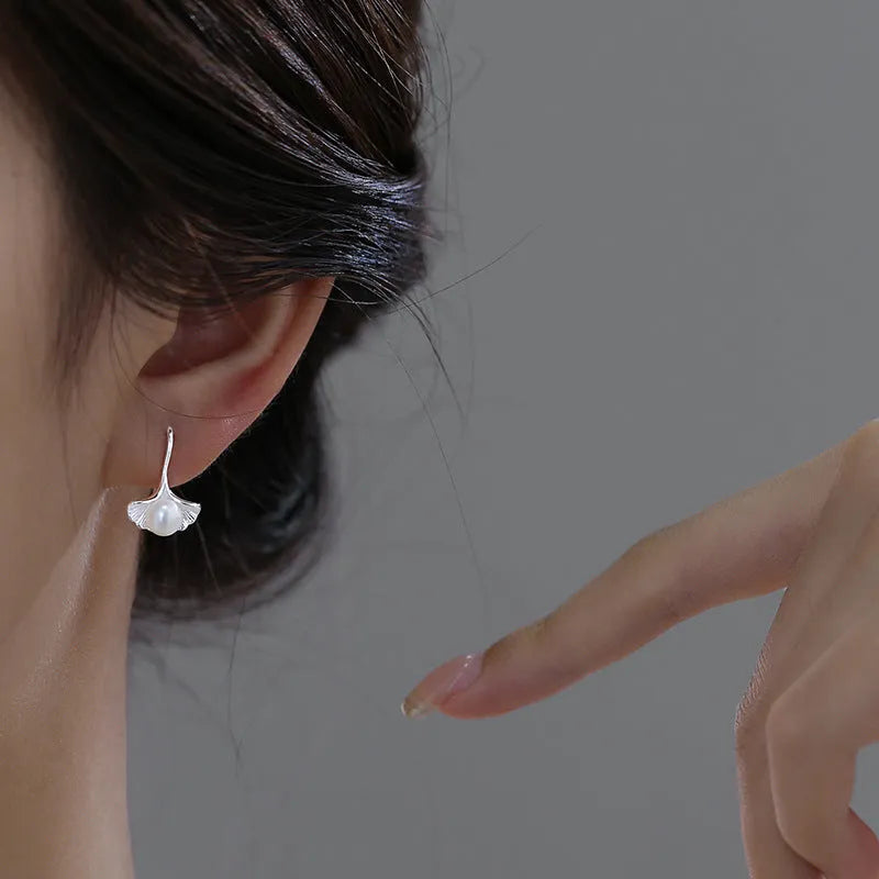 Silver ginkgo leaf ear hooks for women with pearl detail, copper electroplated flower-shaped earrings, one pair