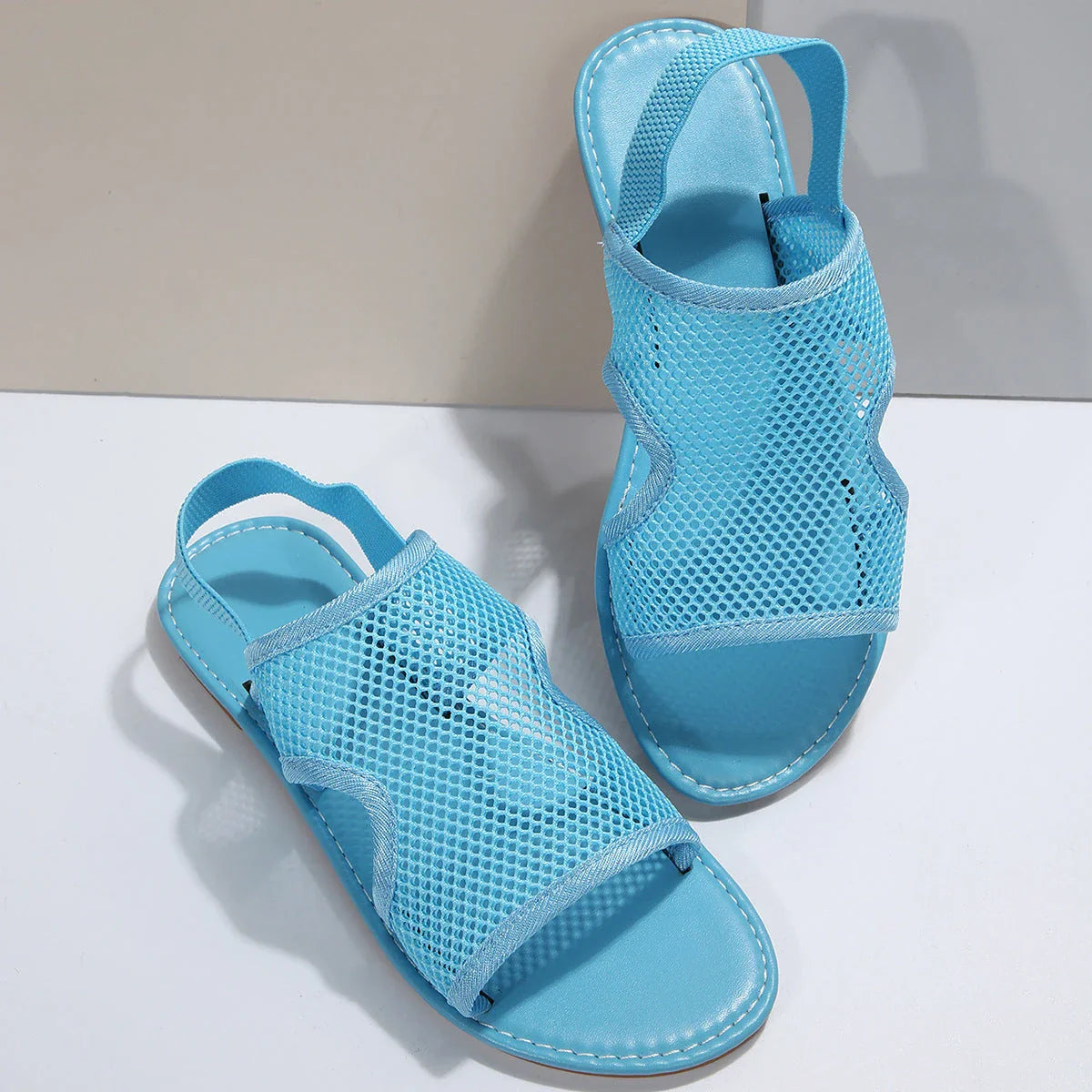 Breathable mesh sandals in various colors and sizes for men and women