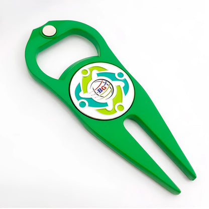 A black zinc alloy golf ball yoke tool with a bottle opener and a separate ball coin on a putting green.