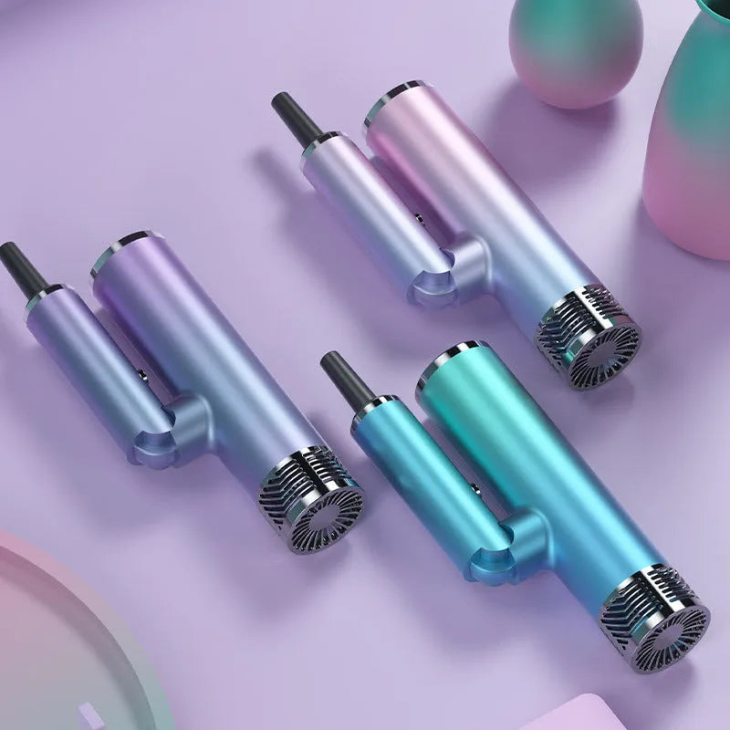 Green and purple foldable hair dryer with collapsed handle showing compact travel size