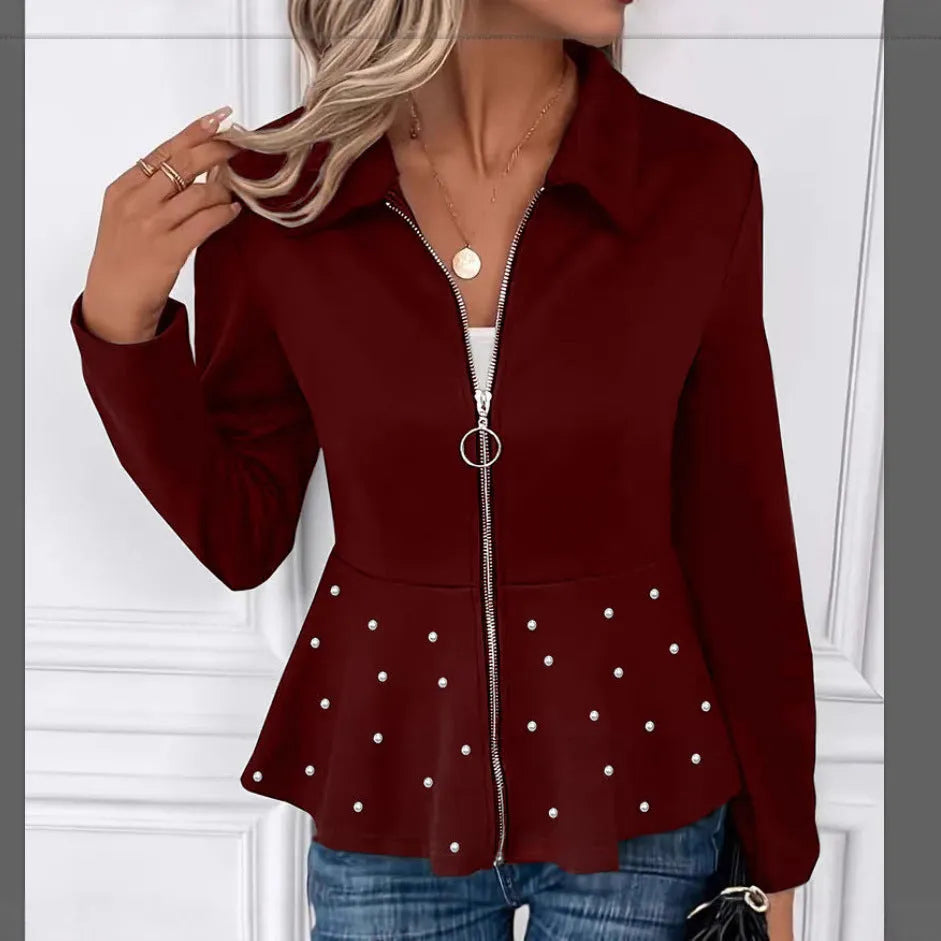 Women's black coat with heavy-duty zipper and ruffled hem detail in loose-fitting silhouette