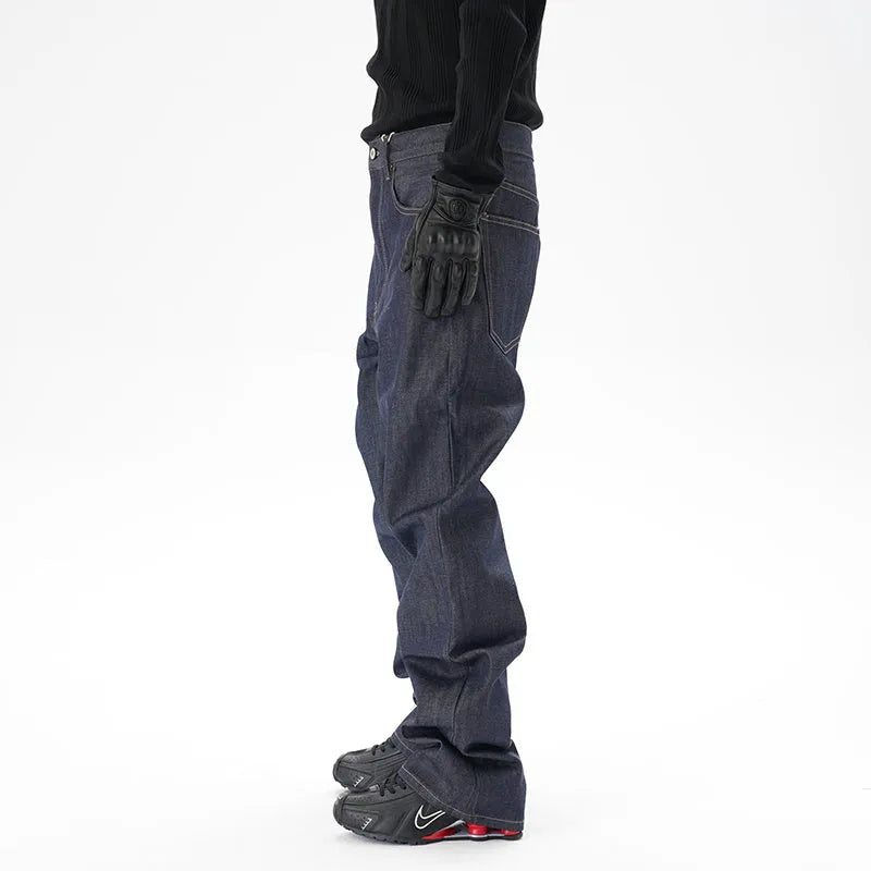 Man wearing dark blue loose-fit straight-leg denim jeans, showcasing the casual relaxed silhouette.