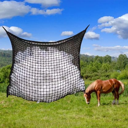 Black woven grid hanging feeding bag for horses, shown against a stable background.