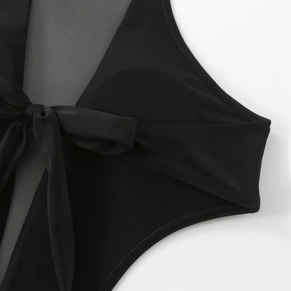 Black women's one-piece swimsuit showing nude back and hollow-out strap design.