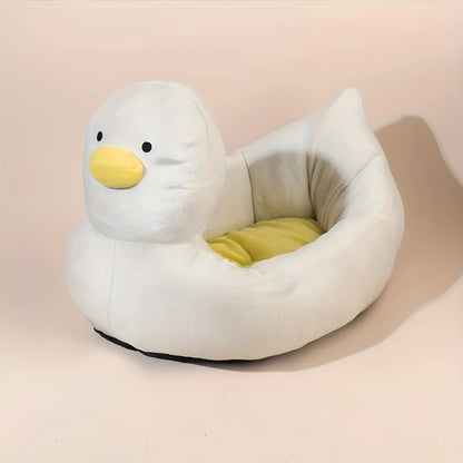 Blue duck shape fluffy pet bed sofa for small dogs and cats on a wooden floor