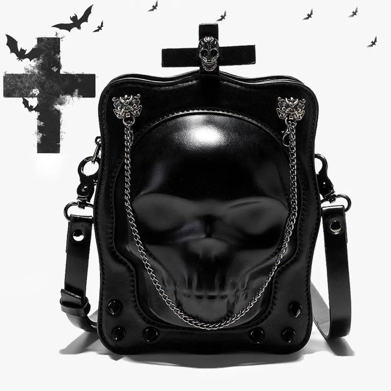 Black mini square messenger bag with embossed skull design, metal chains, and crossbody strap
