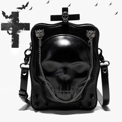Black mini square messenger bag with embossed skull design, metal chains, and crossbody strap