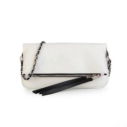 Soft black PU leather women's clutch bag with a gold chain strap, shown held and worn cross-body.