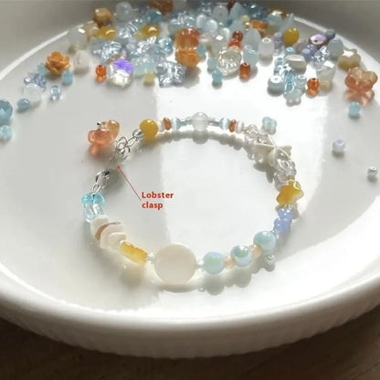 Women's orange mixed material bracelet with a diamond shape and round decorative elements.