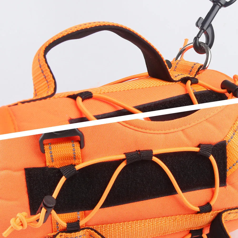 Orange reflective dog harness with attached black hand-holding rope leash shown on a medium-sized dog.