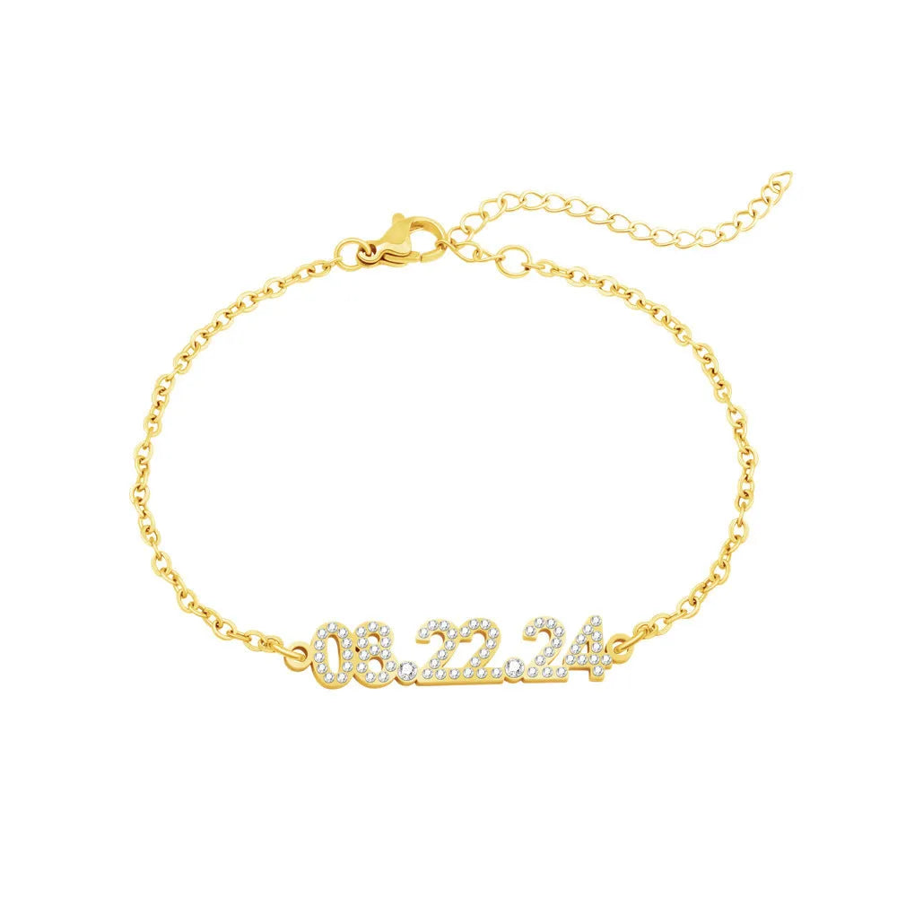 Stainless steel digital bracelet with diamond-set numbers showing time display in gold finish