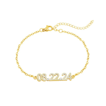 Stainless steel digital bracelet with diamond-set numbers showing time display in gold finish