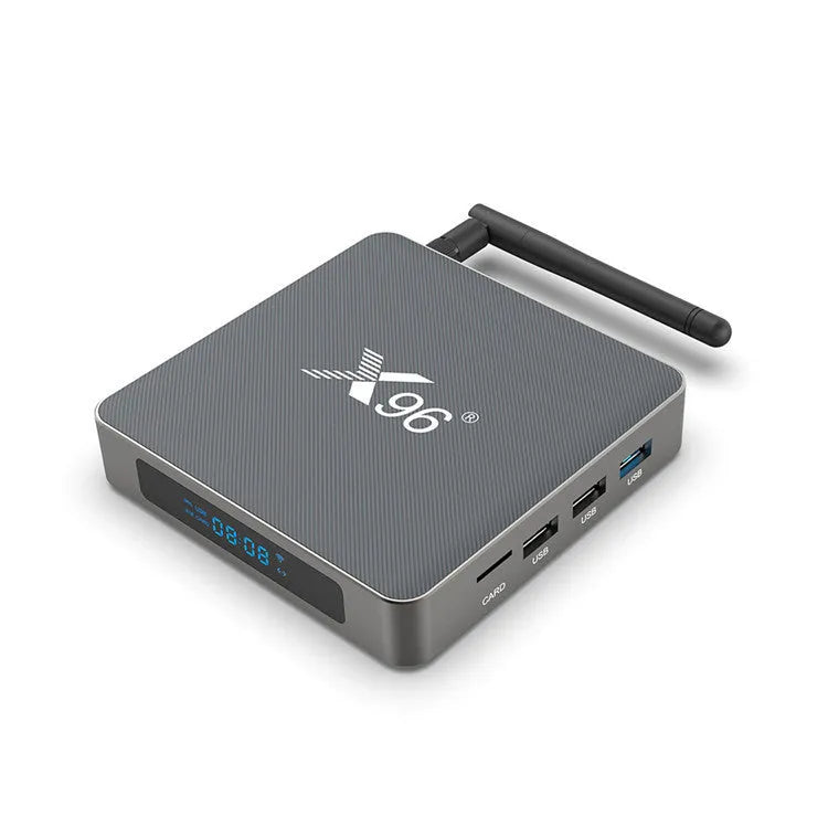 Android smart TV set-top box with remote control and HDMI cable on a wooden surface.