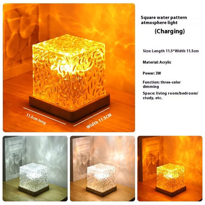 LED water ripple projection night light with remote control on wooden base showing colourful light patterns