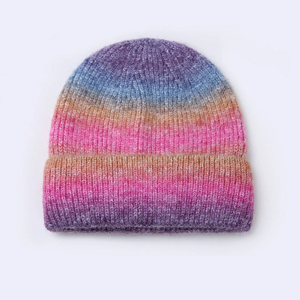 Gradient yarn knitted hat with tapered top in light blue colour showing knitted texture