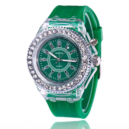 Women's LED luminous quartz watch with silicone strap and round alloy case on wrist