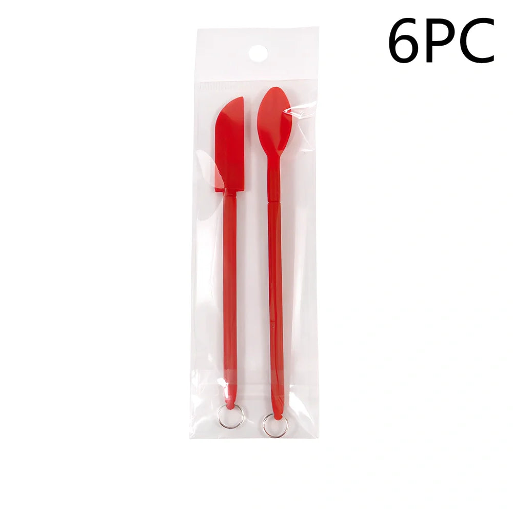 Retractable silicone cosmetic spatula extended to 15cm with scraper tool for product application