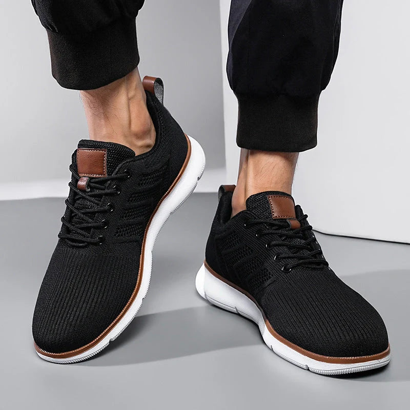 Men's black lace-up mesh sneakers with woven detail for casual and sports wear