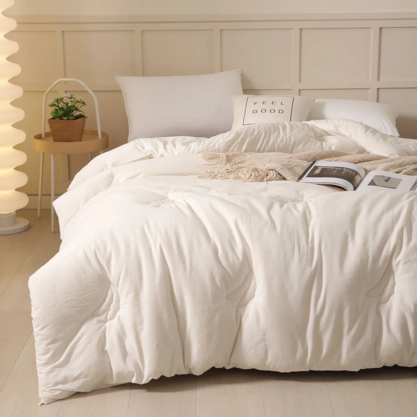 A pure cotton soybean fibre quilt in grey, showing its twill weave texture, laid flat on a bed.
