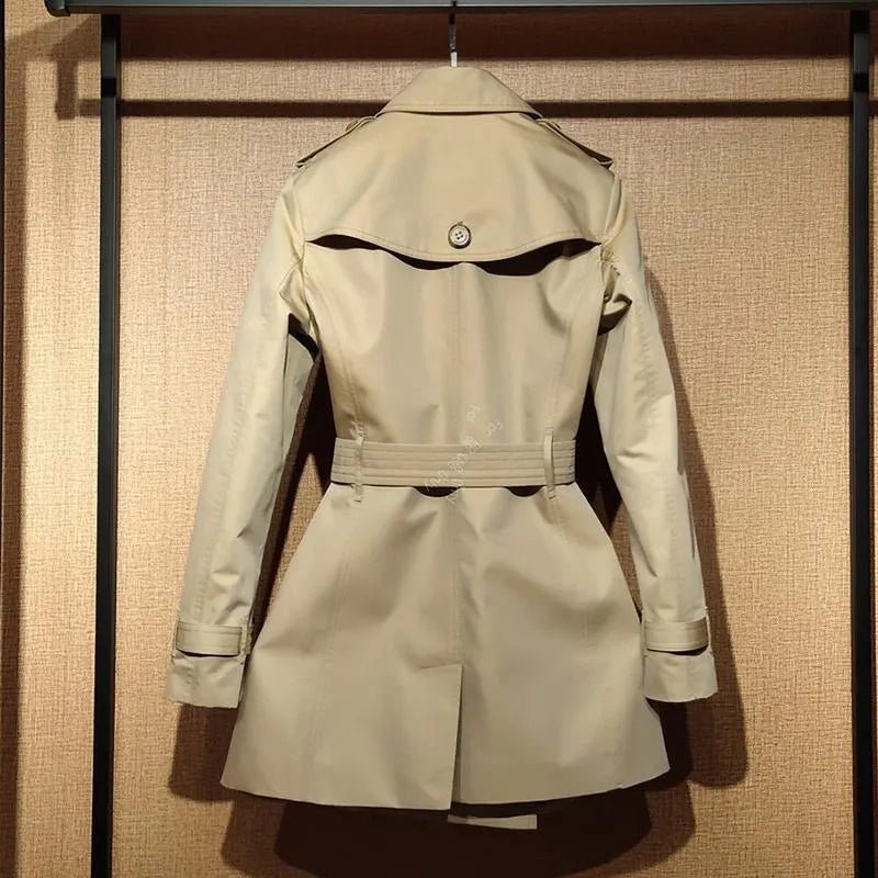 Khaki women's trench coat with double-breasted front and structured shoulder detailing