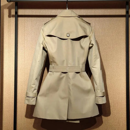 Khaki women's trench coat with double-breasted front and structured shoulder detailing