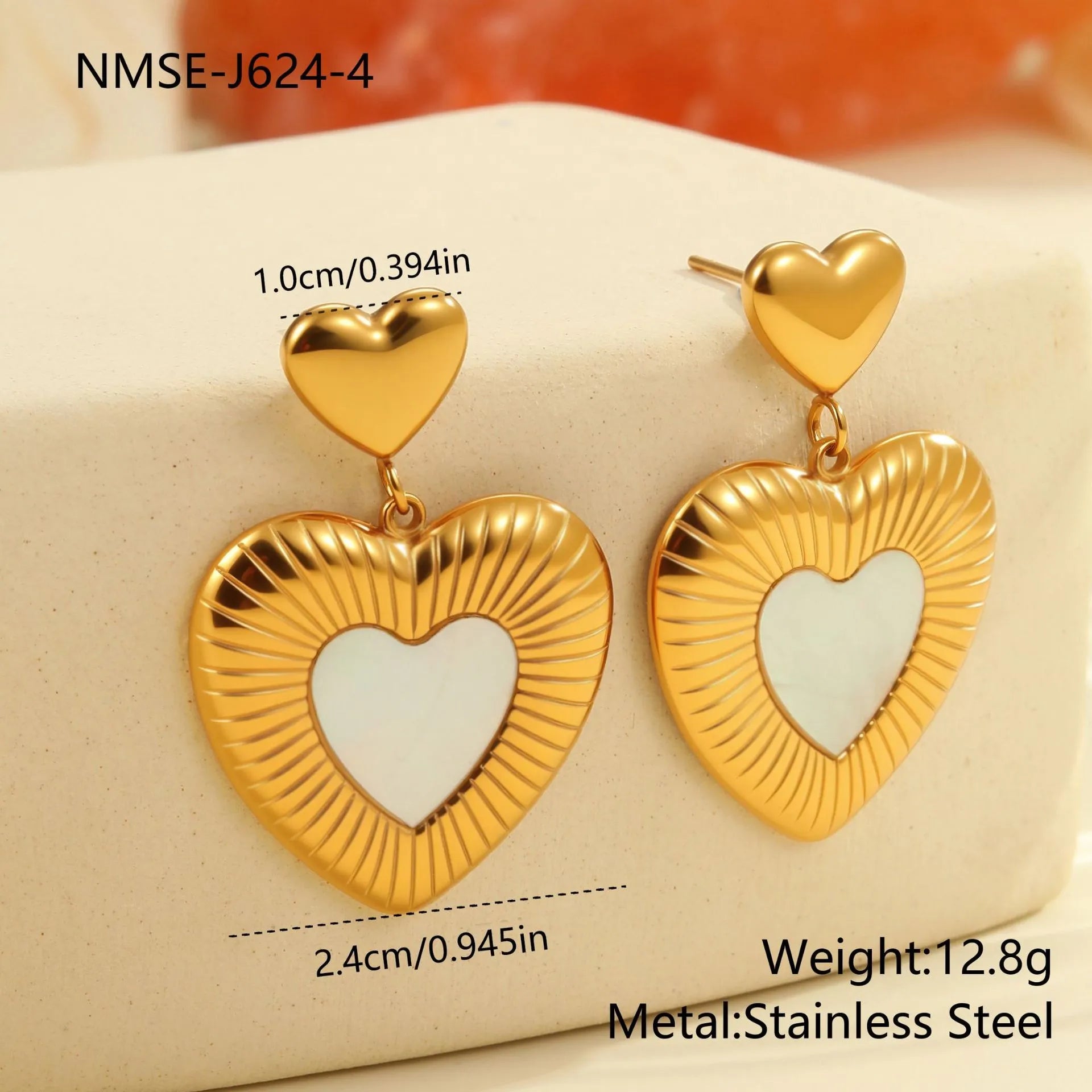 Gold-colour heart-shaped earrings with white fritillary design on stainless steel with electroplating