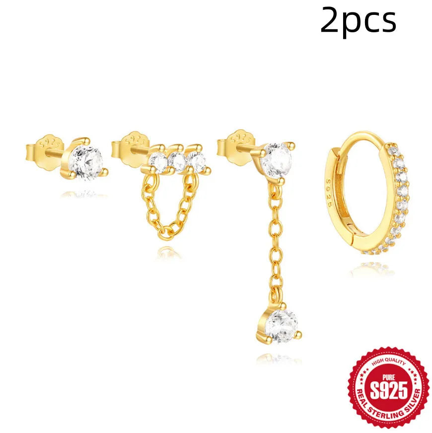 A pair of geometric clover petal shaped earrings in gold, made from S925 sterling silver with an electroplated finish.