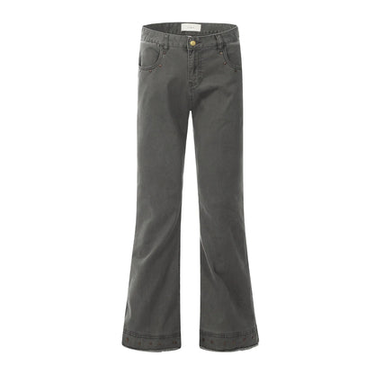 Pair of black straight-leg skinny jeans with a mid-rise waist and zipper fly on a neutral background.