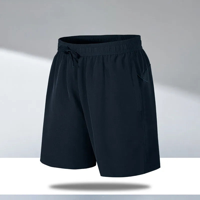 Man wearing black loose-fit ice silk sports shorts with a micro-elastic waistband, suitable for running or casual summer wear.