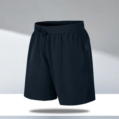 Man wearing black loose-fit ice silk sports shorts with a micro-elastic waistband, suitable for running or casual summer wear.
