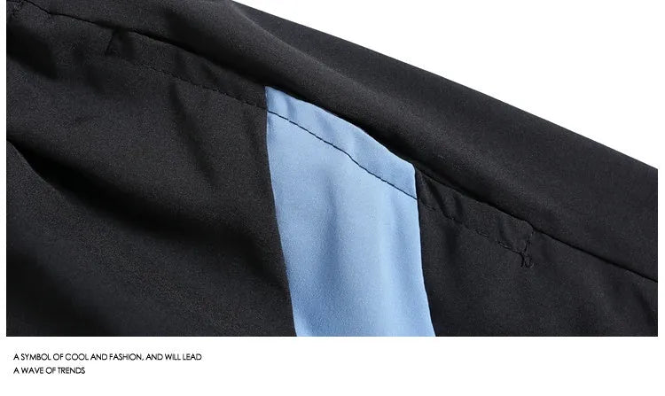 Men's black loose-fit quick-dry sports shorts with elastic waist, shown above the knee.